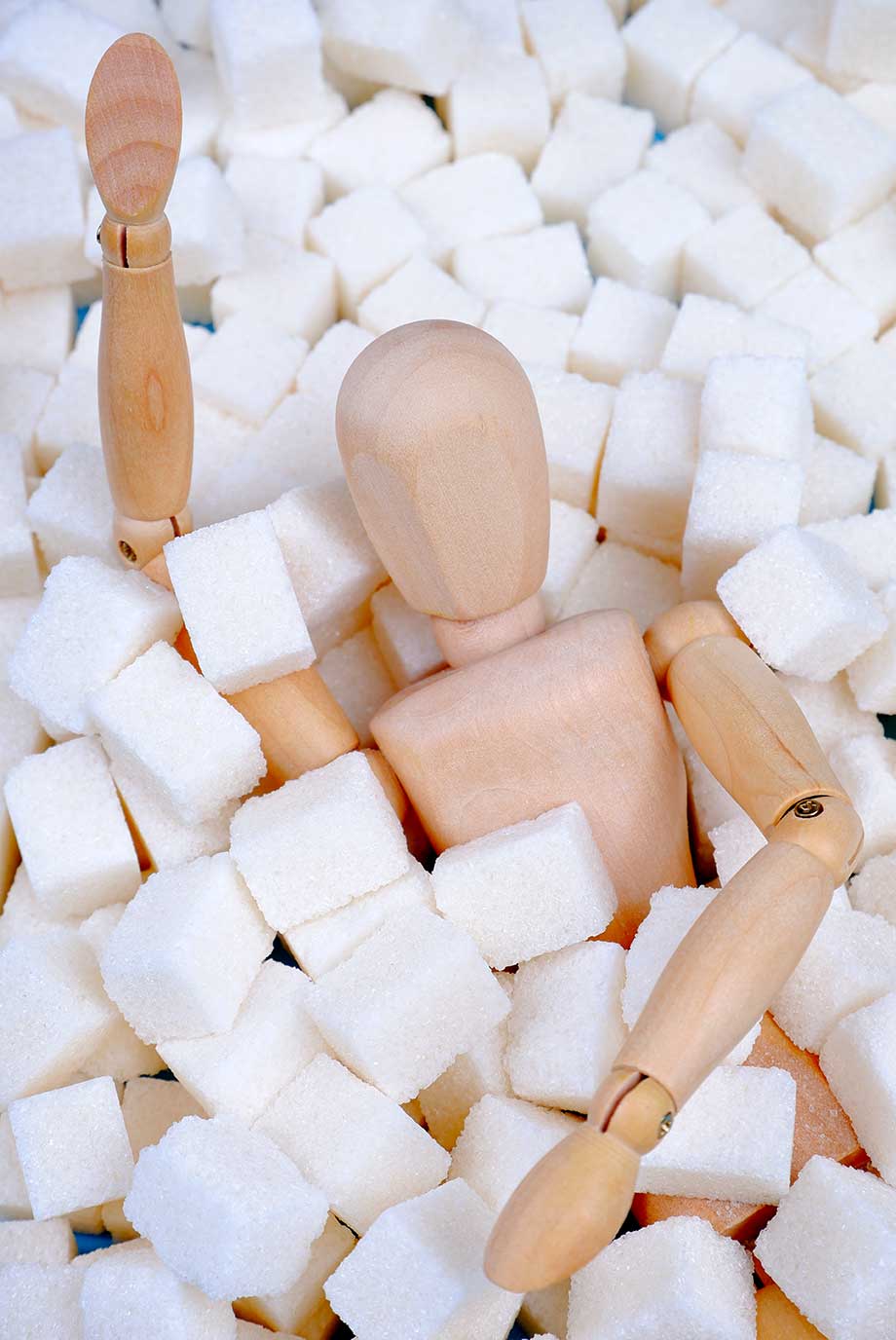fake-body-covered-by-mounds-of-cane-sugar-cubes-suggesting-sugarholic
