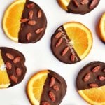 Nutritious and delicious dark chocolate dipped orange slices with goji berries is the perfect gluten-free, paleo and vegan treat by julie at goodiegoodieglutenfree.com