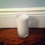 A plain homemade glass of hemp milk in a tall glass