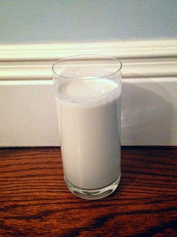 A plain homemade glass of hemp milk in a tall glass