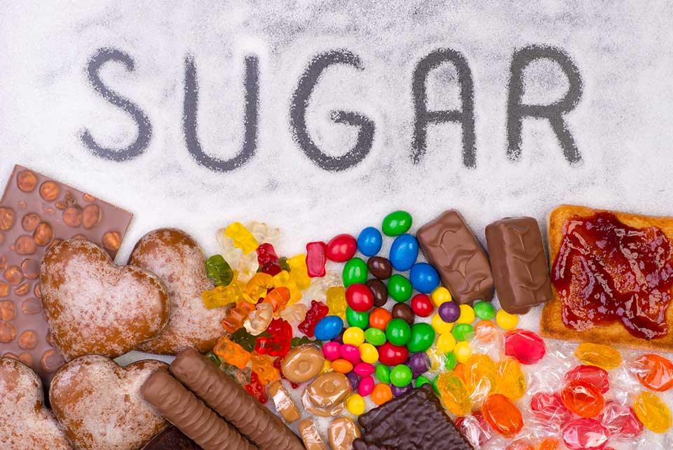 The-words-sugar-written-in-sugar-with-images-of-candy-gummy-bears-chocolate-hearts-chocolate-bars-and-junk-food-picture